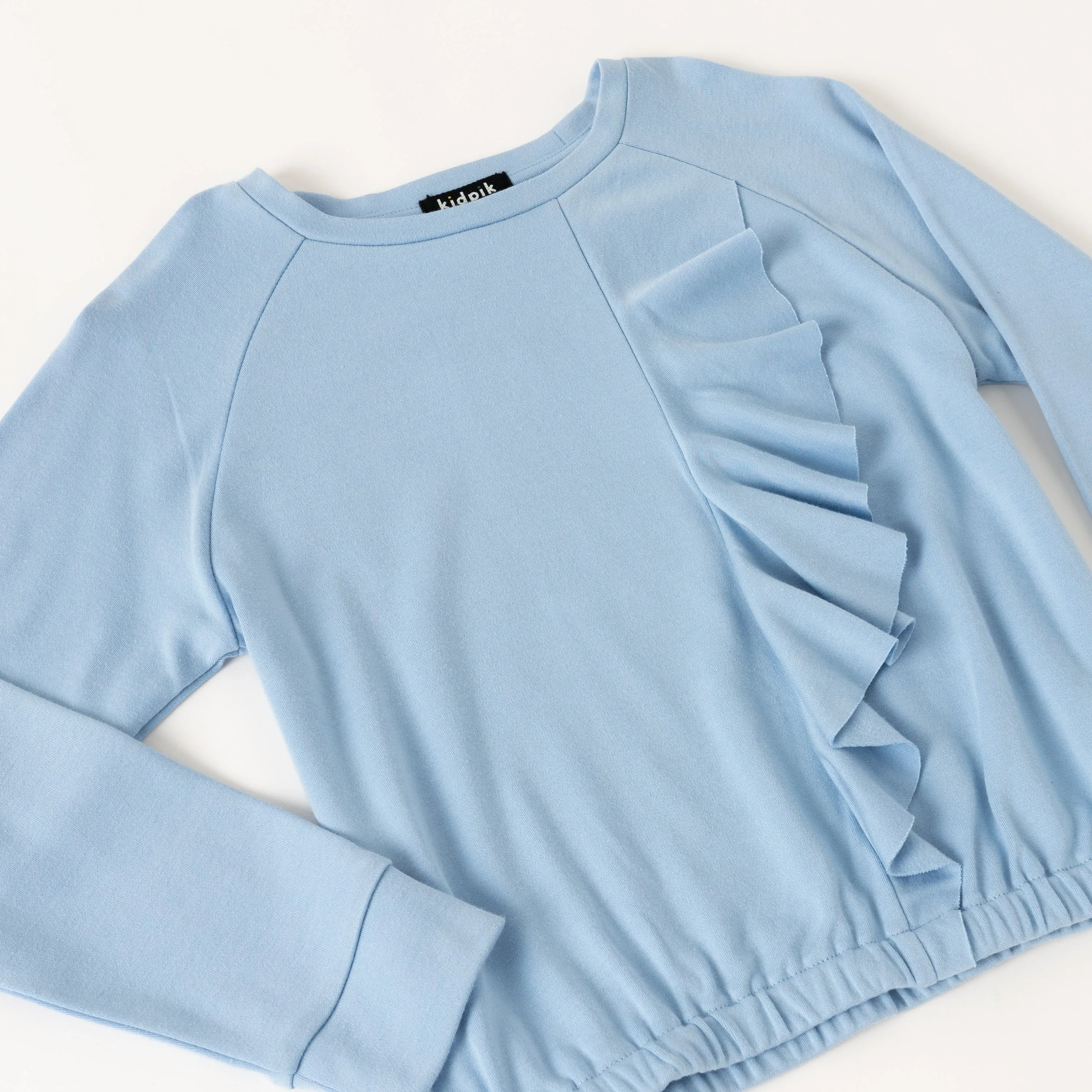 Cascading Ruffle Fleece Top